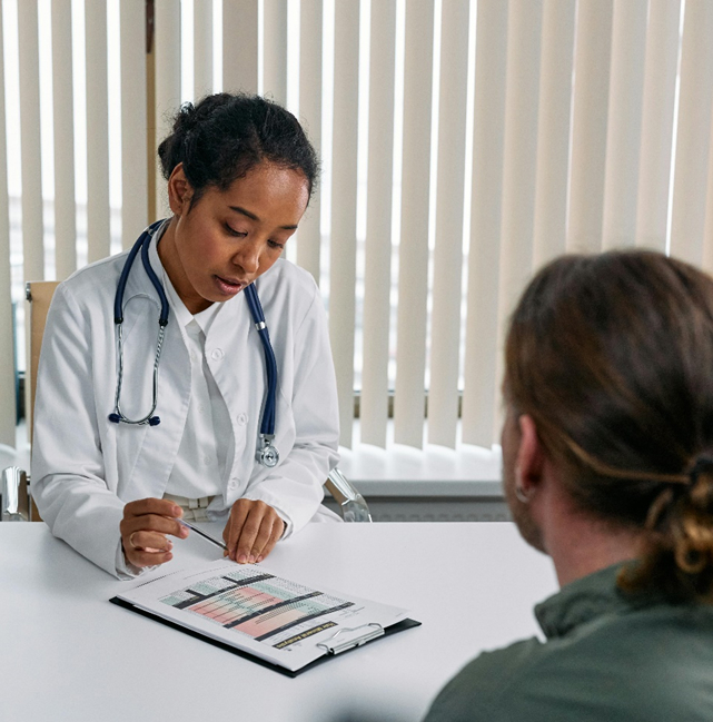 Doctor reviewing document with patient 